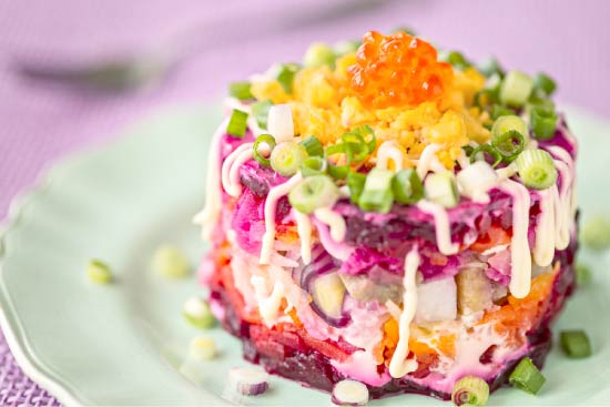 Portioned herring under a fur coat